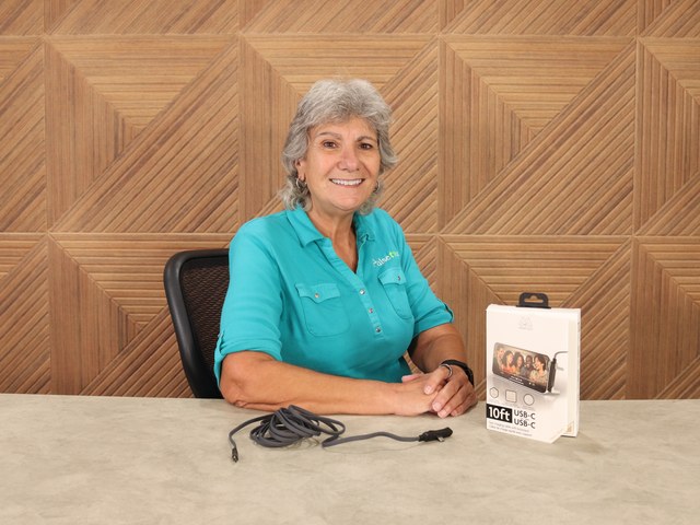 Anisa reviewing a PulseTV product on camera